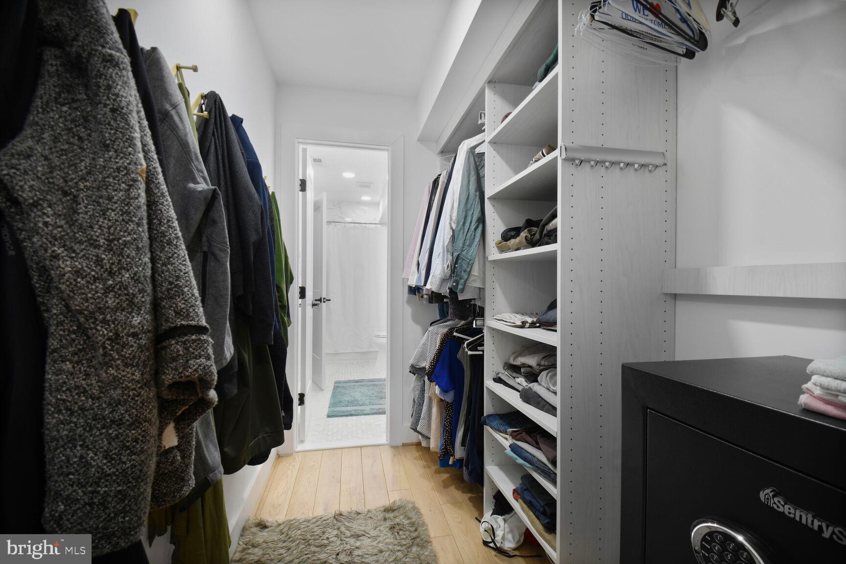 1427 K Street Southeast Washington, DC 20003 - Photo 26 of 30 a view of walk in closet with clothes and shoes