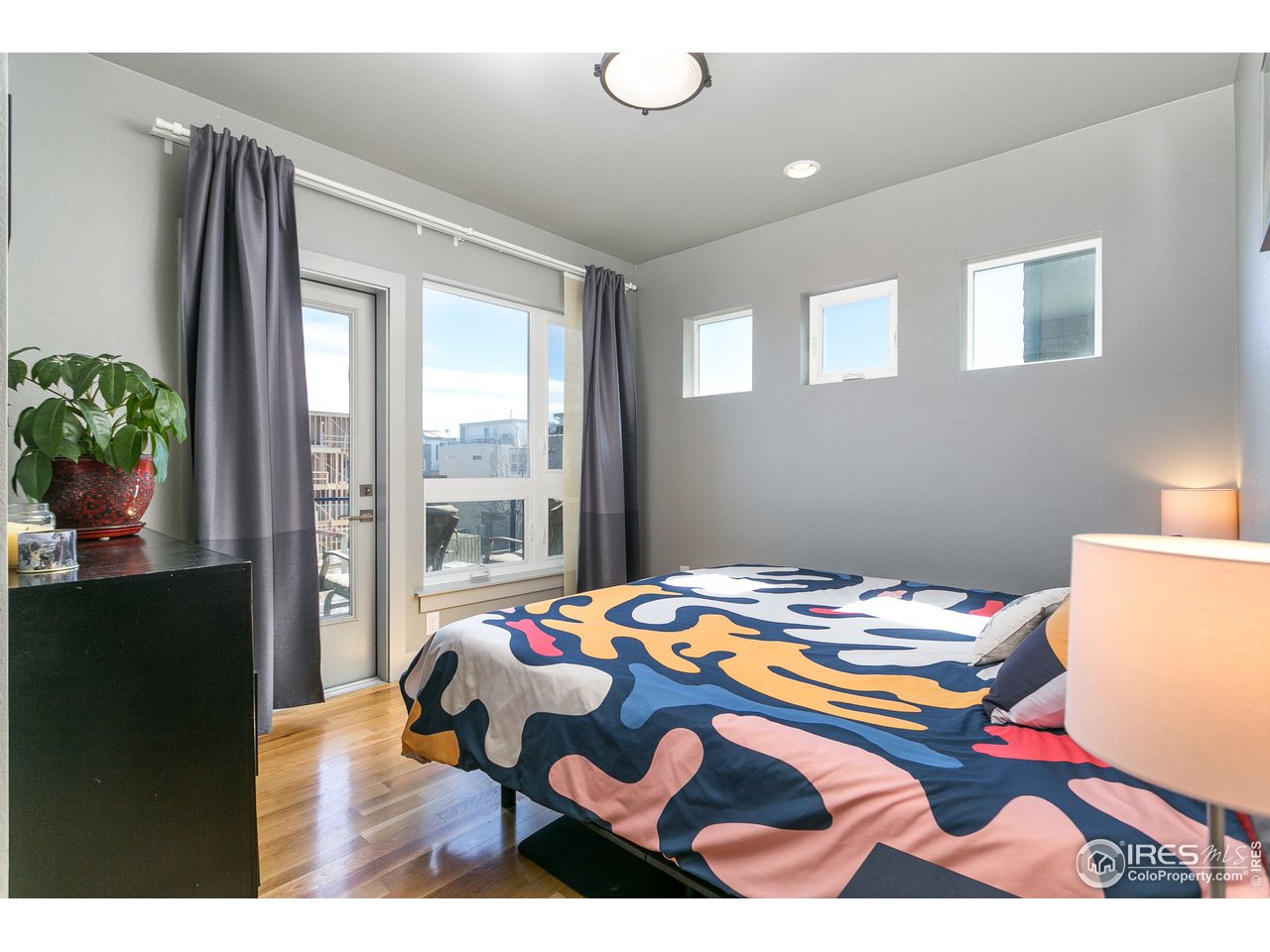 1925 Hooker Street Denver, CO 80204 - Photo 18 of 31 a bedroom with a bed and a window