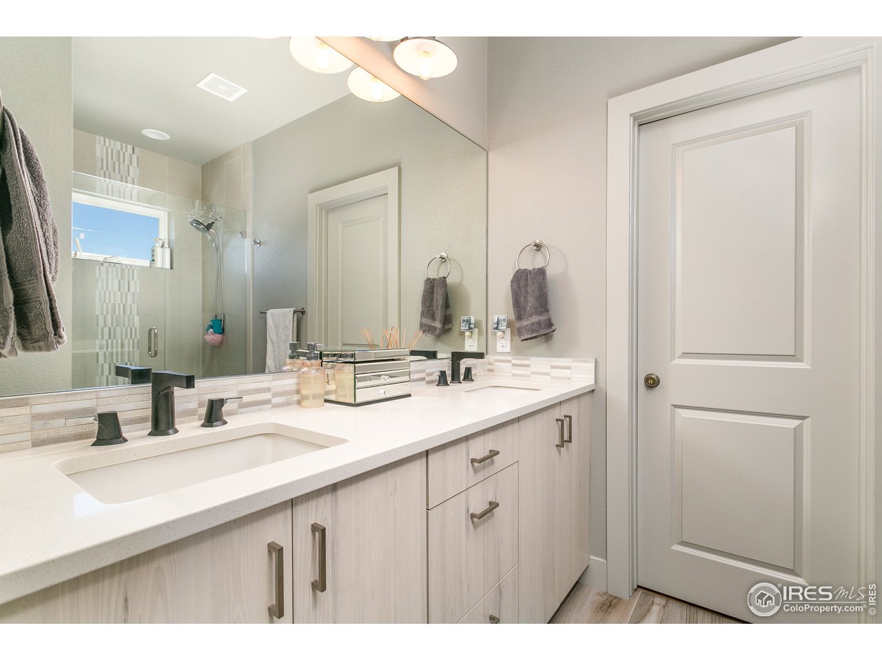 1925 Hooker Street Denver, CO 80204 - Photo 20 of 31 a bathroom with a sink and a mirror
