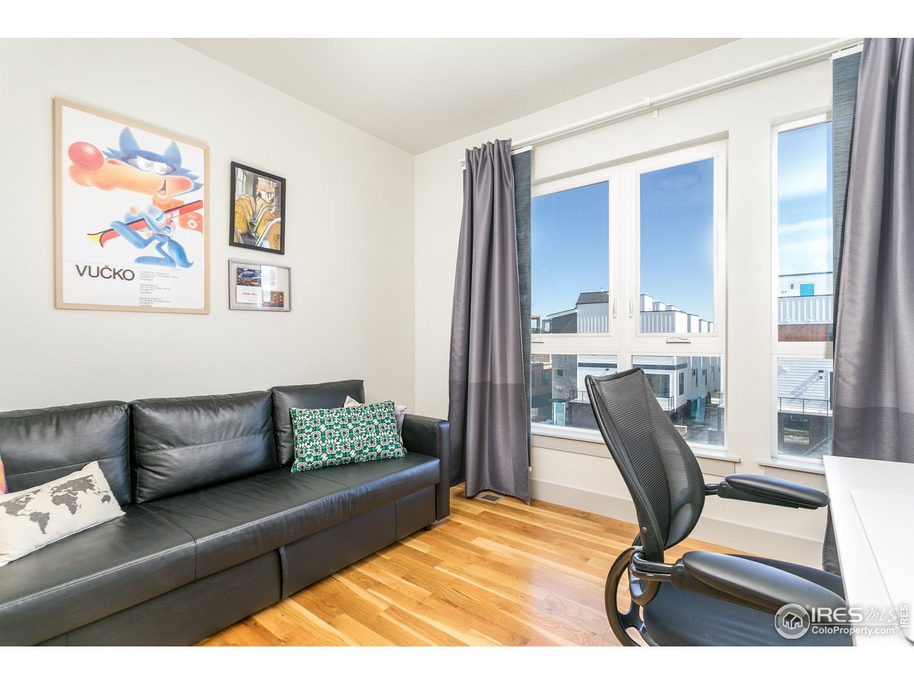 1925 Hooker Street Denver, CO 80204 - Photo 21 of 31 a living room with furniture and a rug