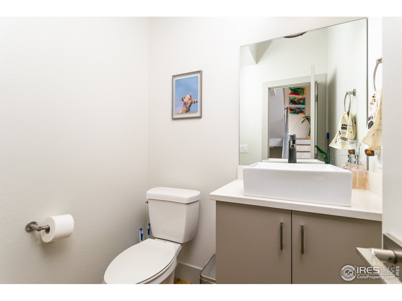 1925 Hooker Street Denver, CO 80204 - Photo 6 of 31 a bathroom with a sink a toilet and mirror