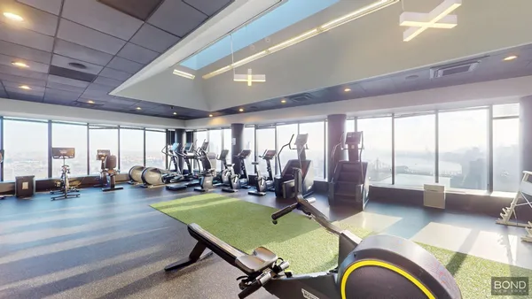 a room with lots of table and chairs