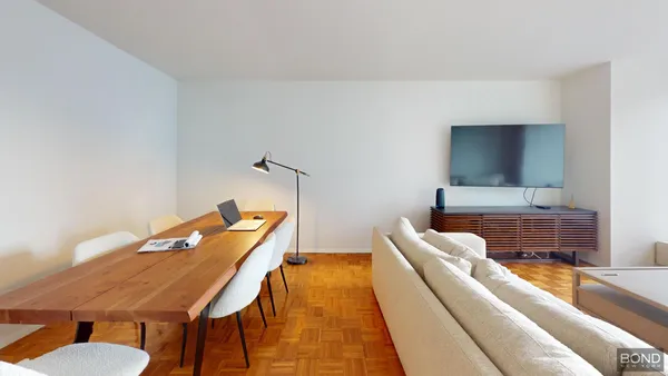 a living room with furniture and a rug