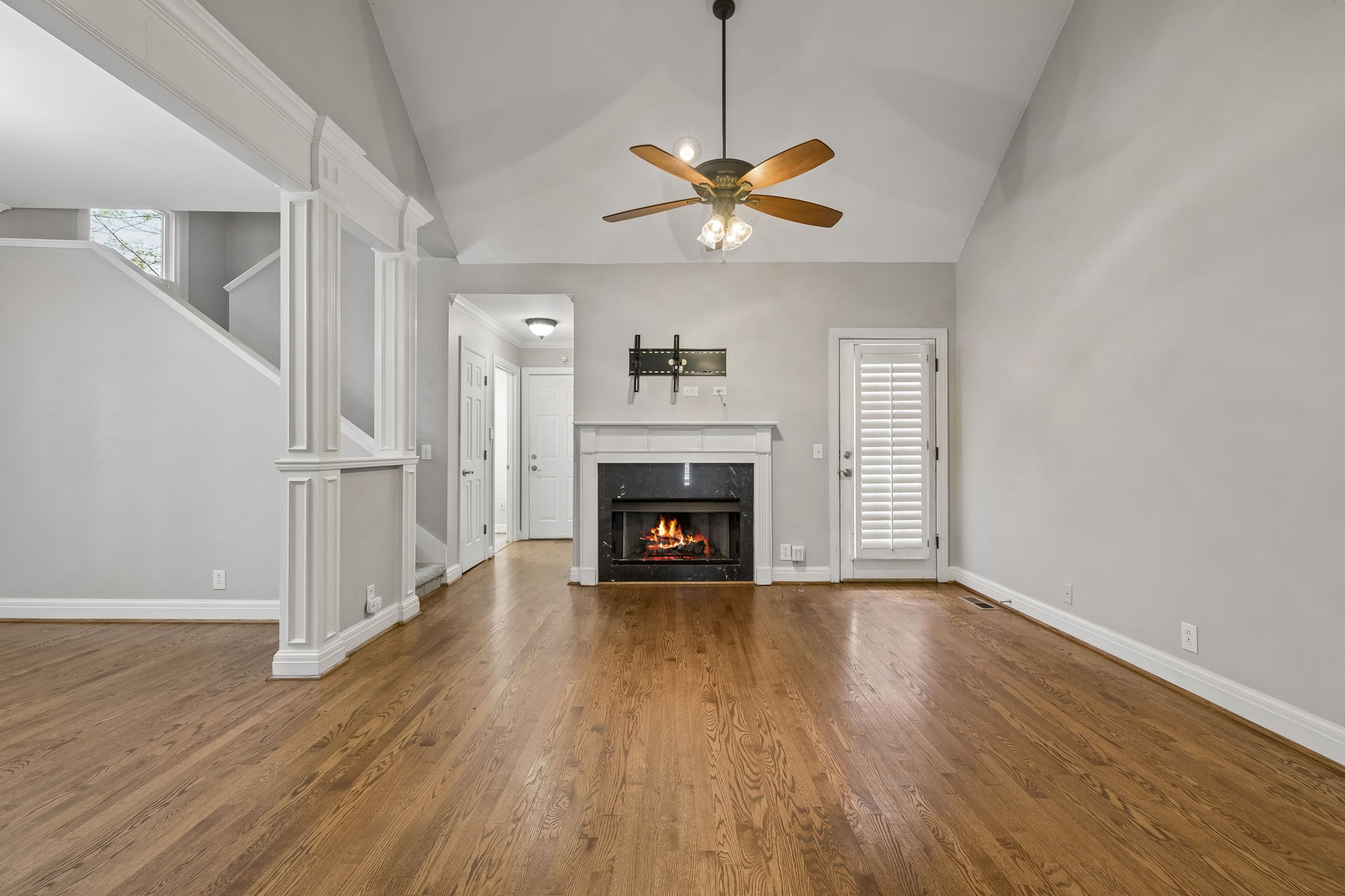 230 Harding Place Nashville, TN 37205 - Photo 11 of 54 a view of an empty room with wooden floor fireplace and a window