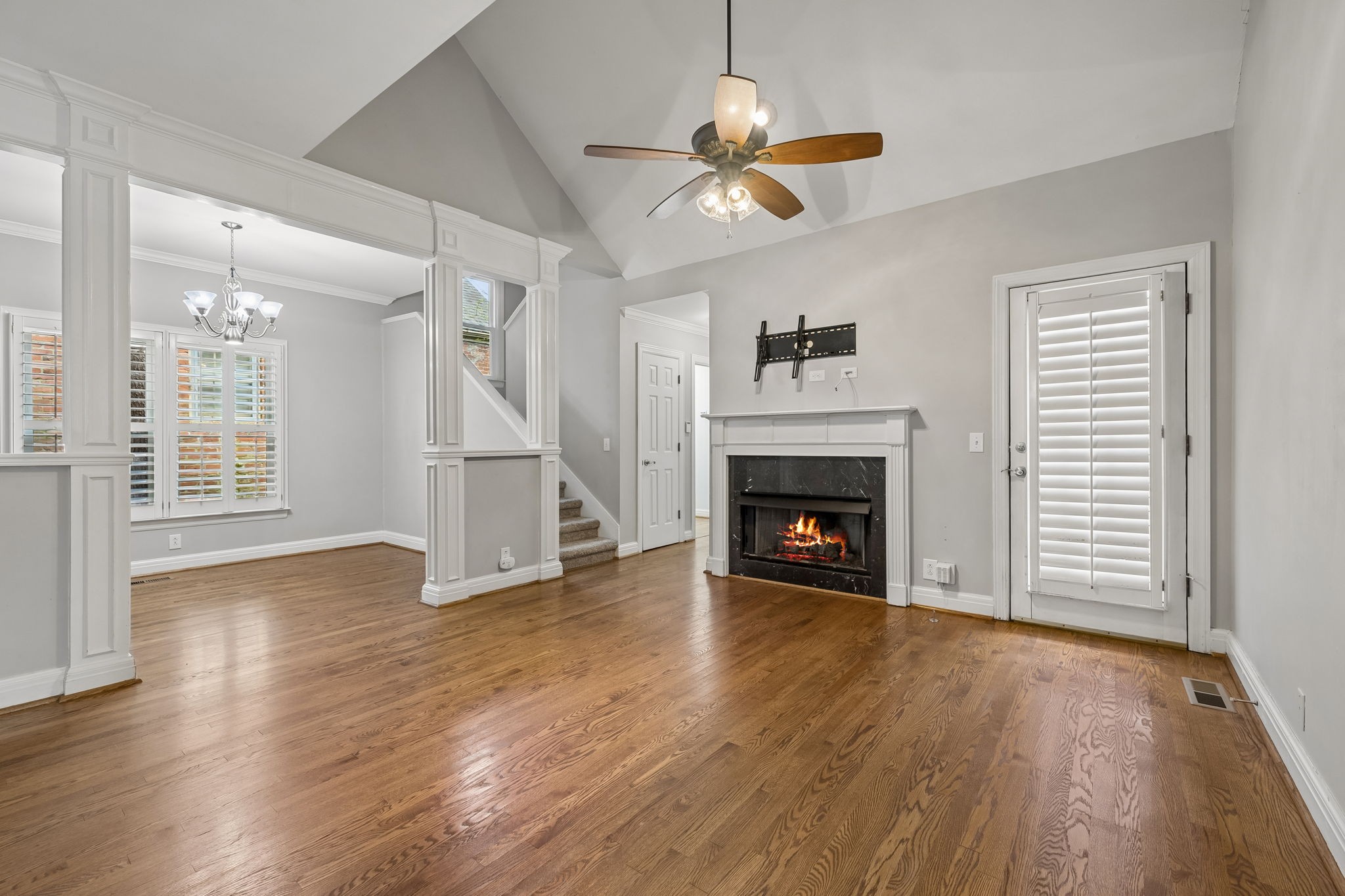 230 Harding Place Nashville, TN 37205 - Photo 12 of 54 a view of an empty room with wooden floor fireplace and a window