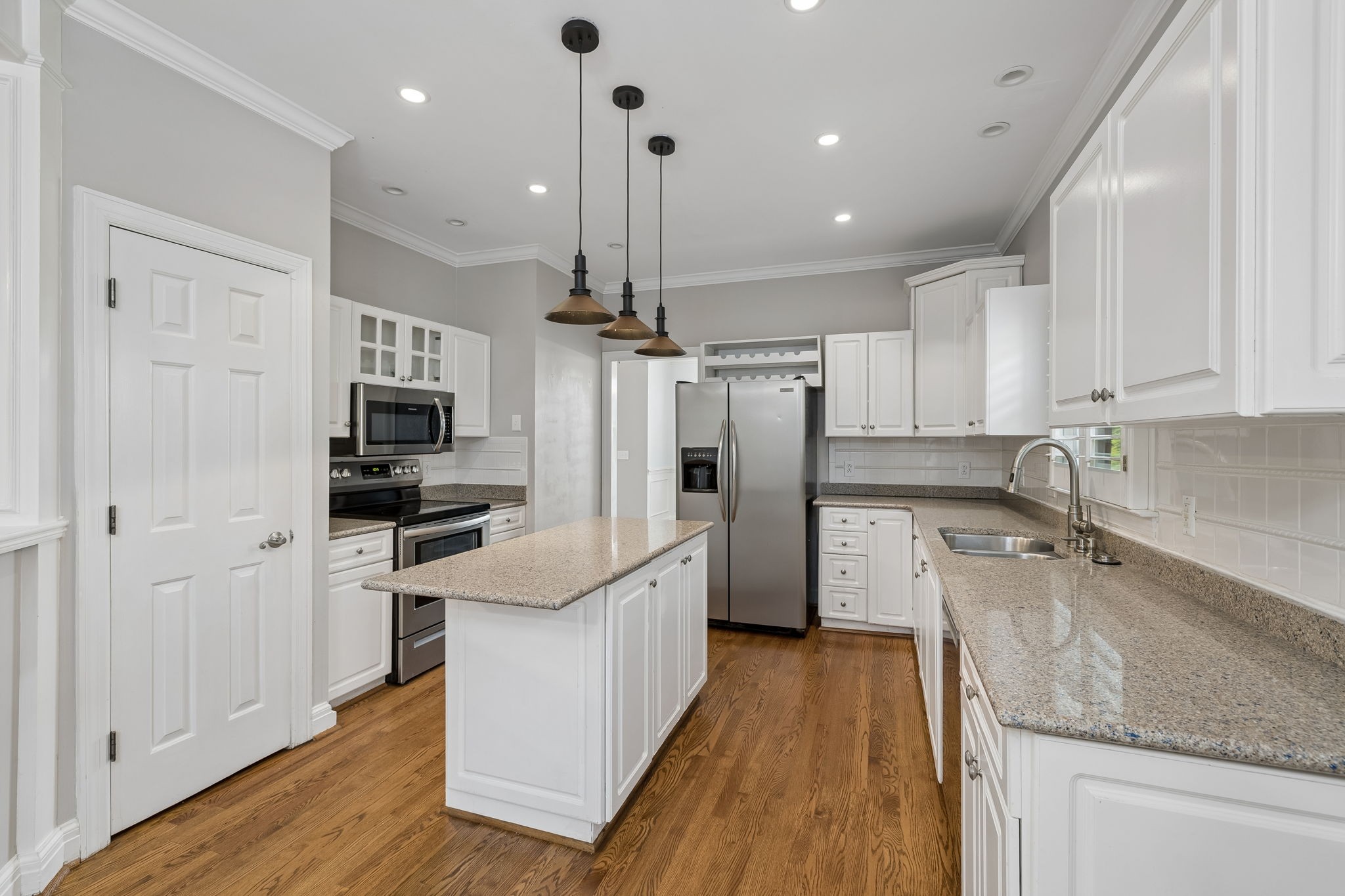 230 Harding Place Nashville, TN 37205 - Photo 17 of 54 a kitchen with stainless steel appliances granite countertop a sink refrigerator and cabinets