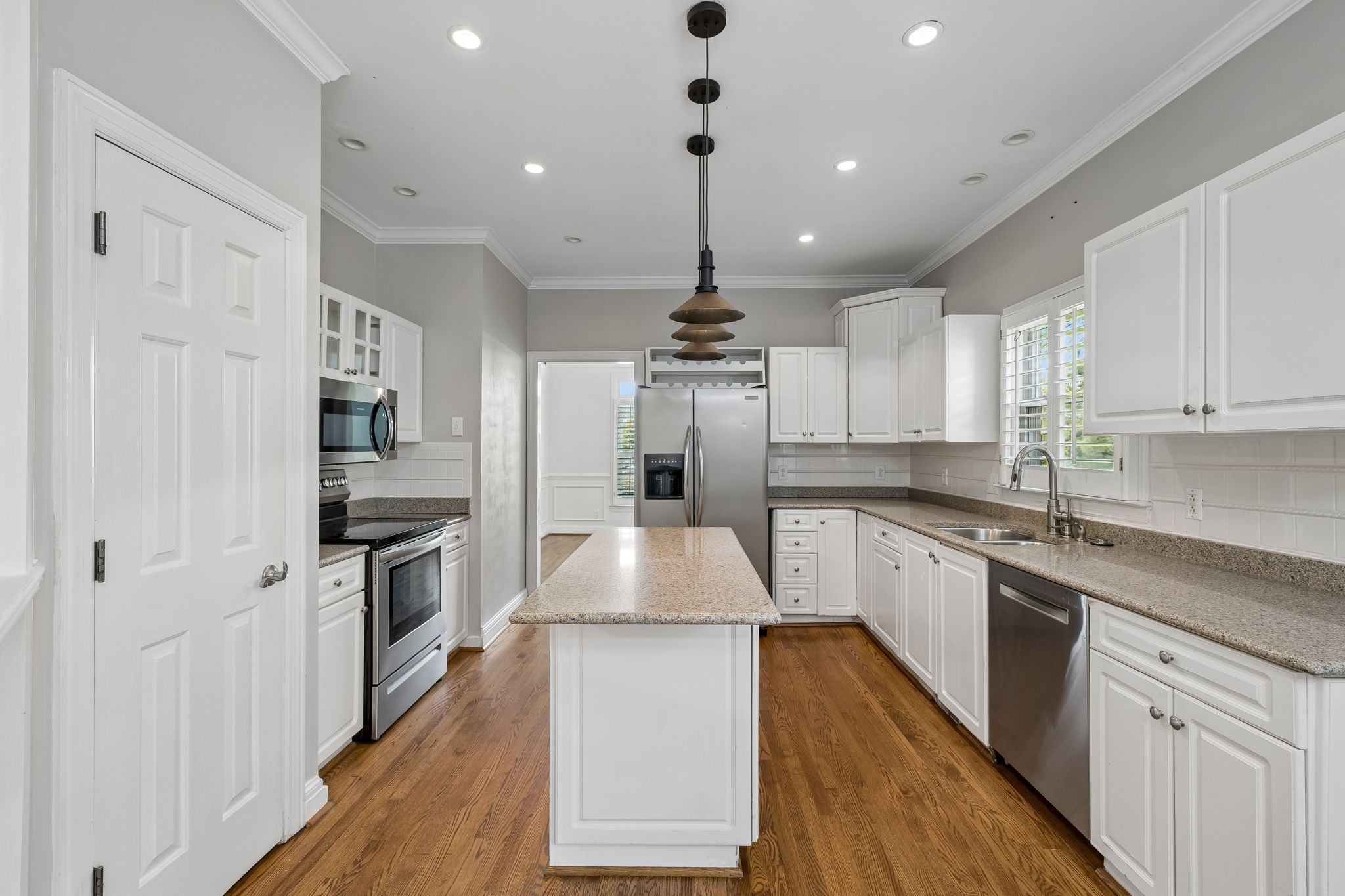 230 Harding Place Nashville, TN 37205 - Photo 18 of 54 a large kitchen with stainless steel appliances granite countertop a lot of counter space and wooden floors