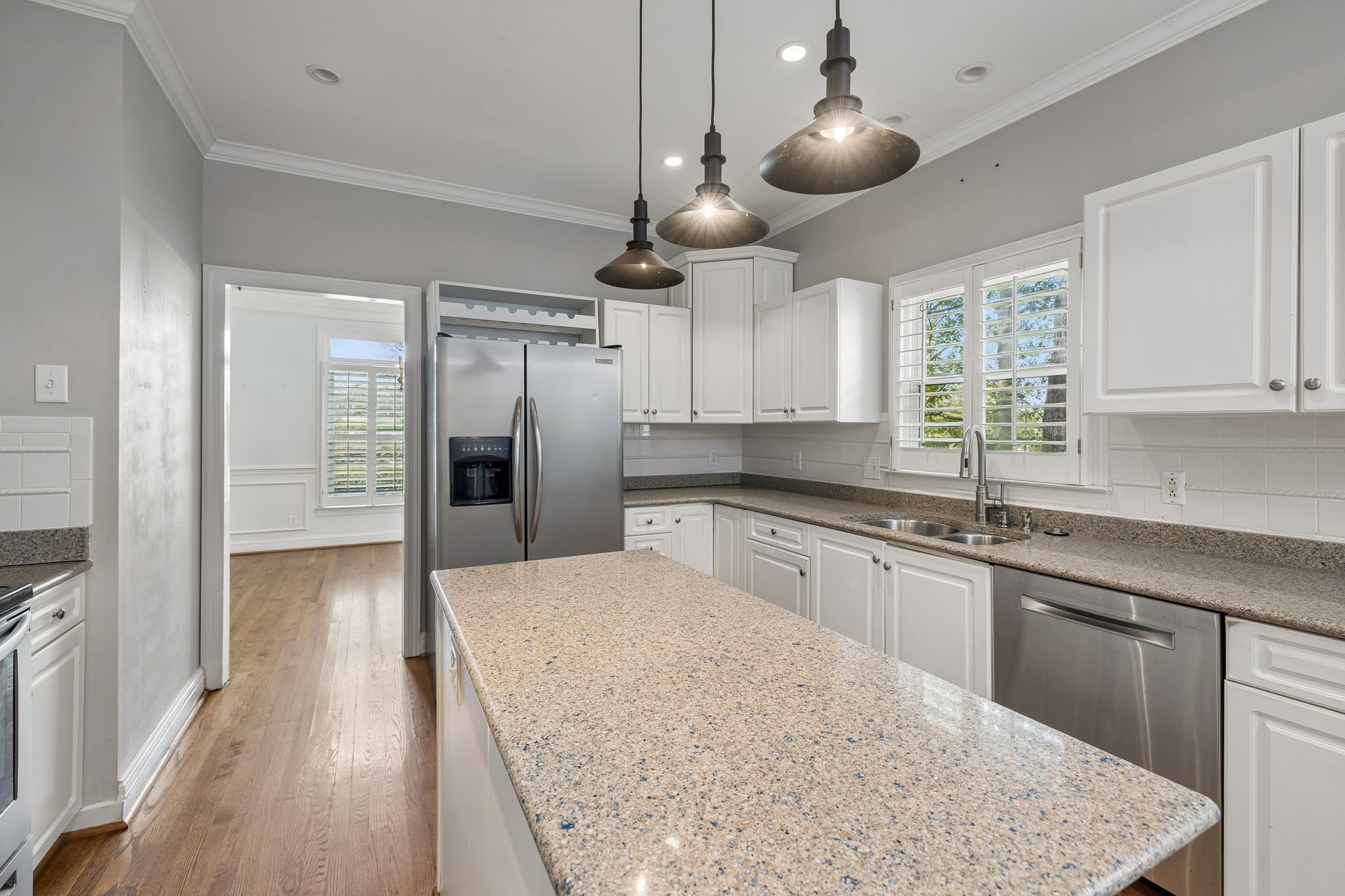 230 Harding Place Nashville, TN 37205 - Photo 19 of 54 a kitchen with stainless steel appliances granite countertop a sink a refrigerator and window