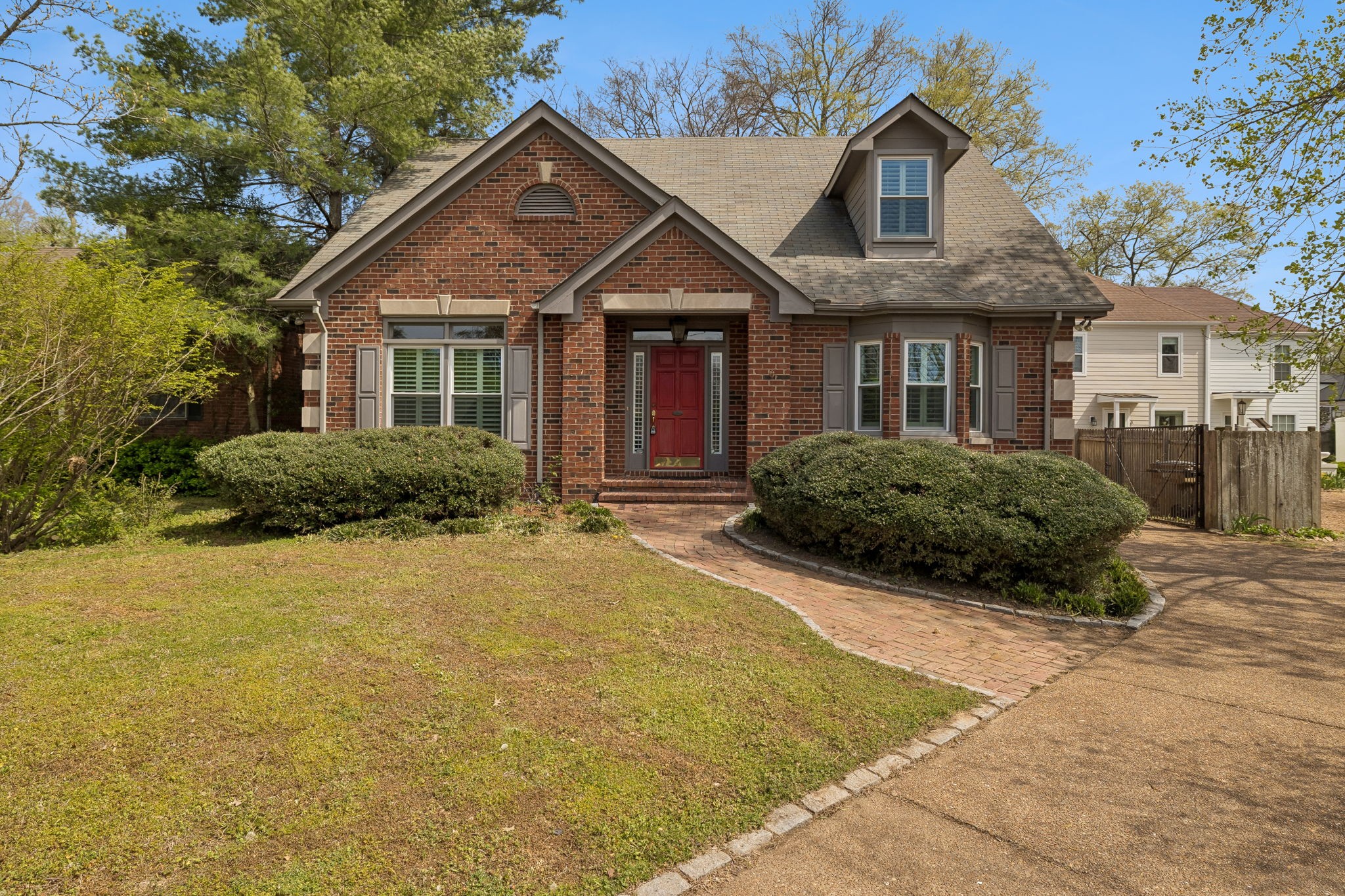 230 Harding Place Nashville, TN 37205 - Photo 2 of 54 a front view of a house with a yard