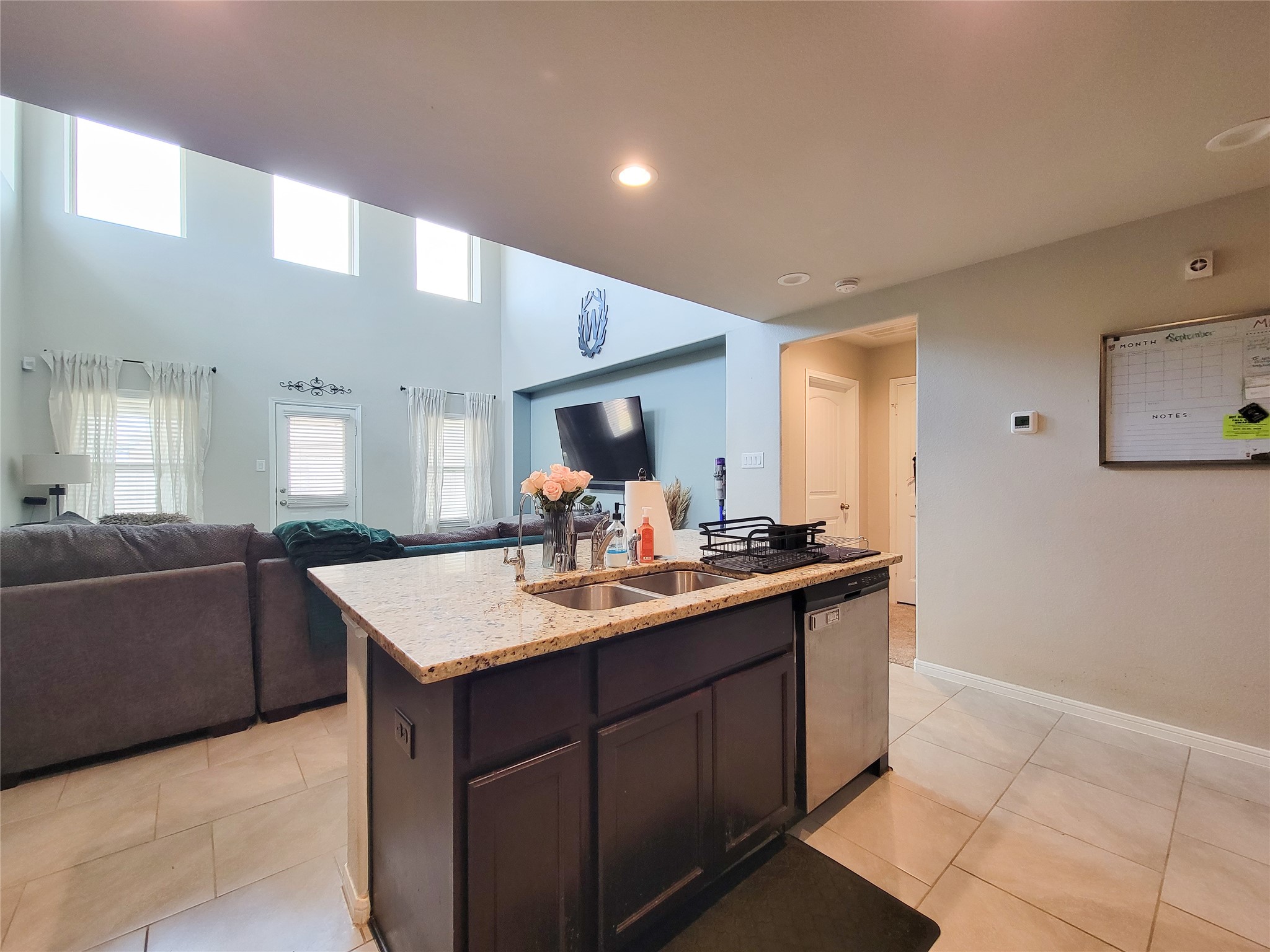 8003 Ecru Lane Rosharon, TX 77583 - Photo 19 of 43 a kitchen with a sink and a stove top oven with wooden floor