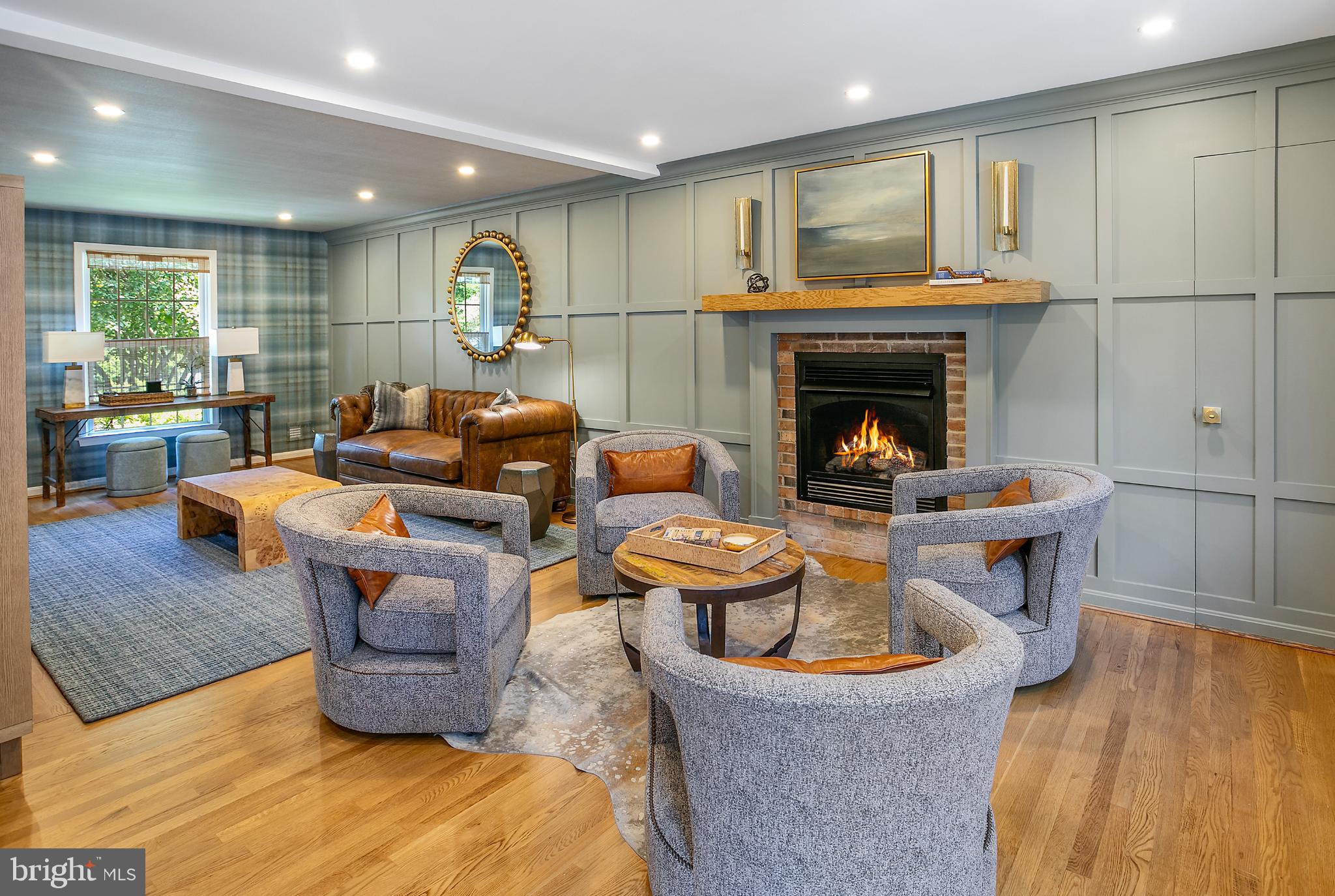 1212 Old Stable Road McLean, VA 22102 - Photo 11 of 33 a living room with furniture and a fireplace