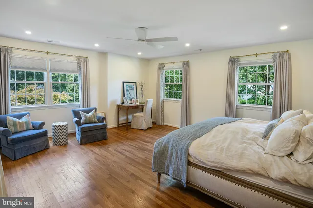 a bedroom with a bed and a couch