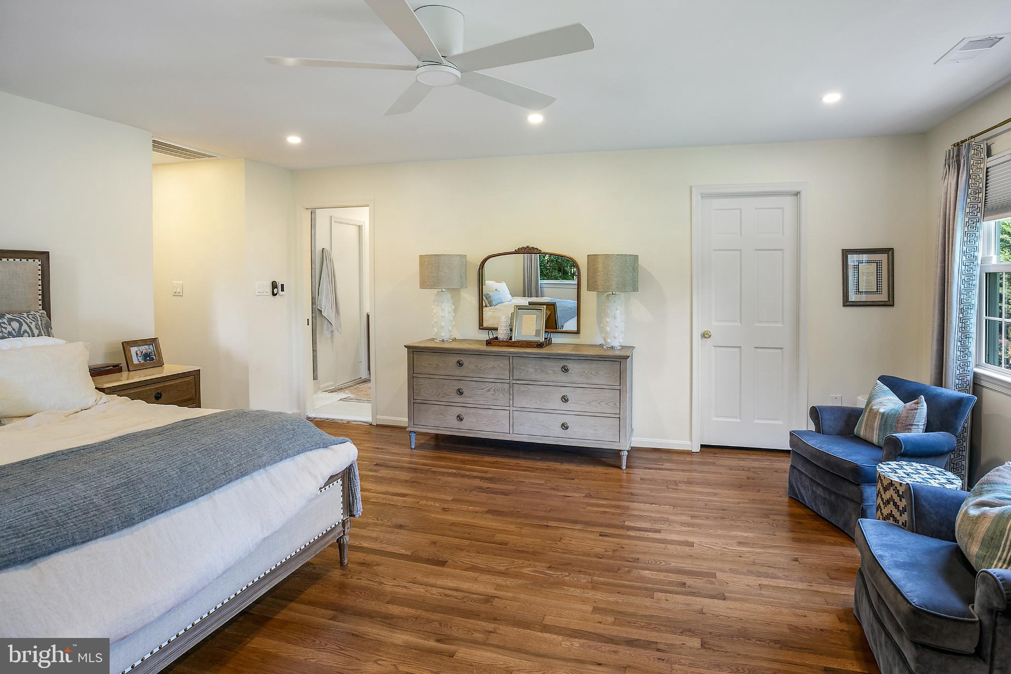 1212 Old Stable Road McLean, VA 22102 - Photo 15 of 33 a spacious bedroom with a bed and a couch