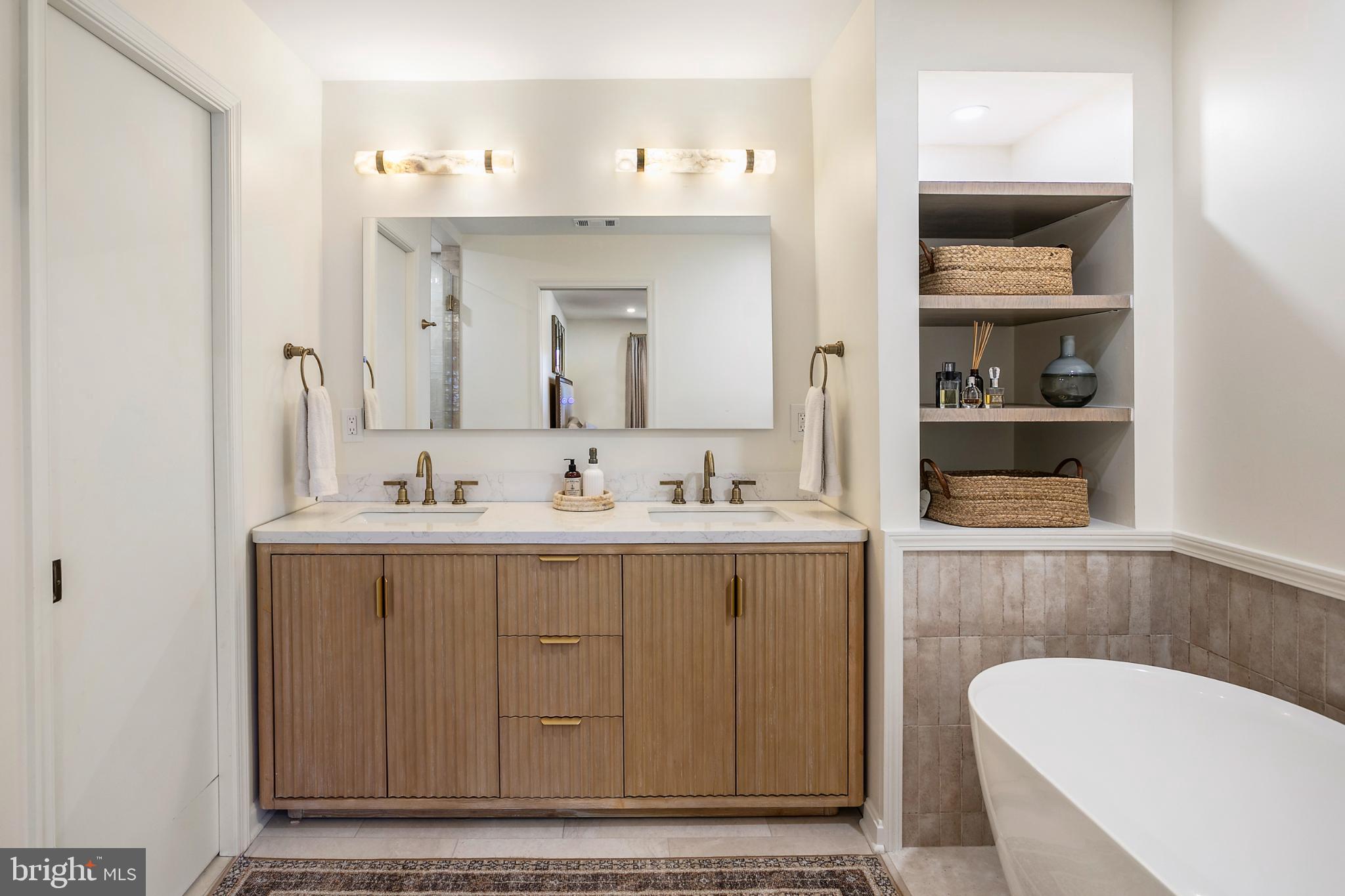 1212 Old Stable Road McLean, VA 22102 - Photo 16 of 33 a bathroom with a sink and a mirror