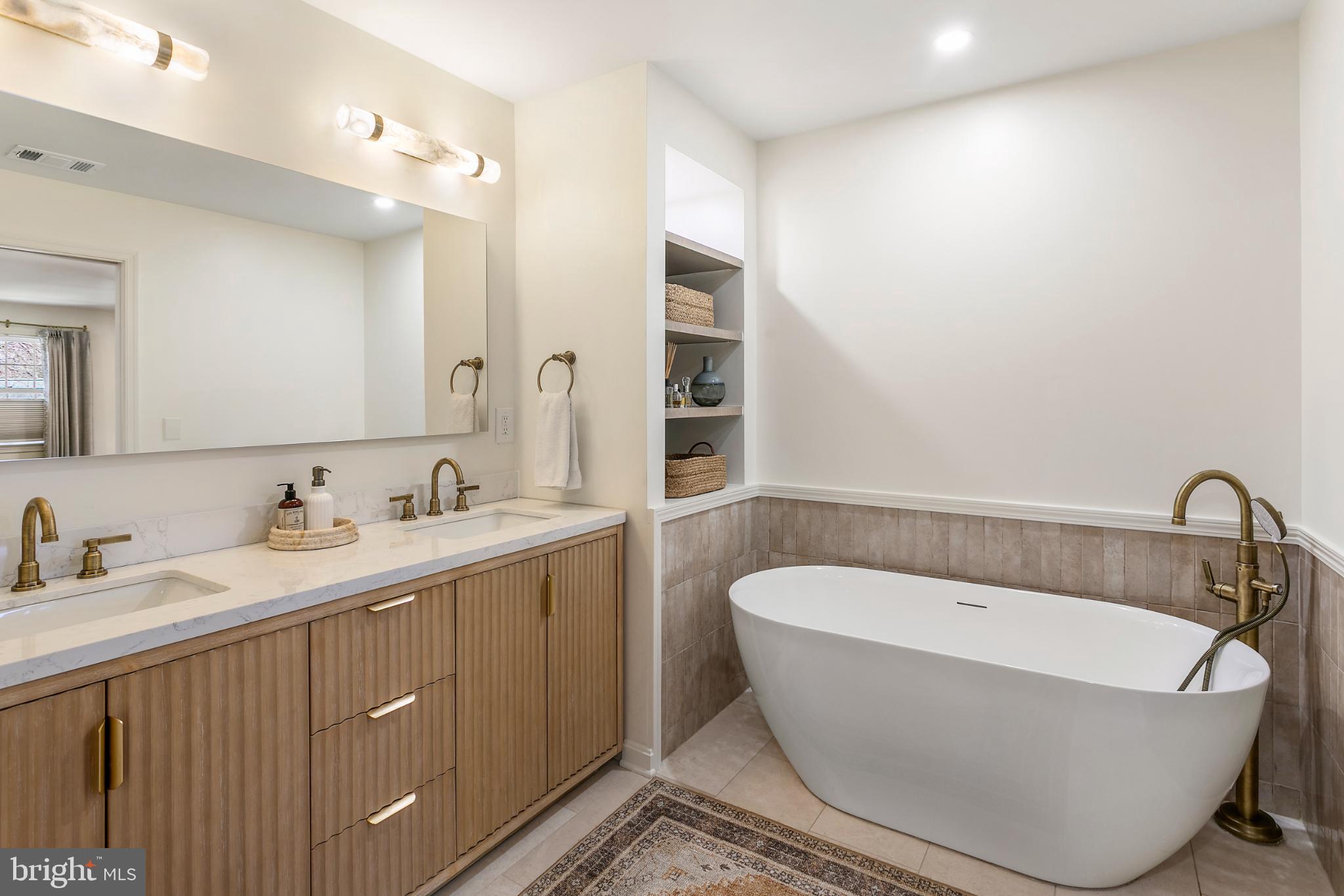 1212 Old Stable Road McLean, VA 22102 - Photo 17 of 33 a bathroom with a bathtub and double sink