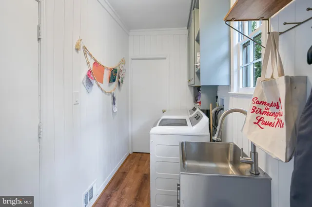 a utility room with dryer and washer