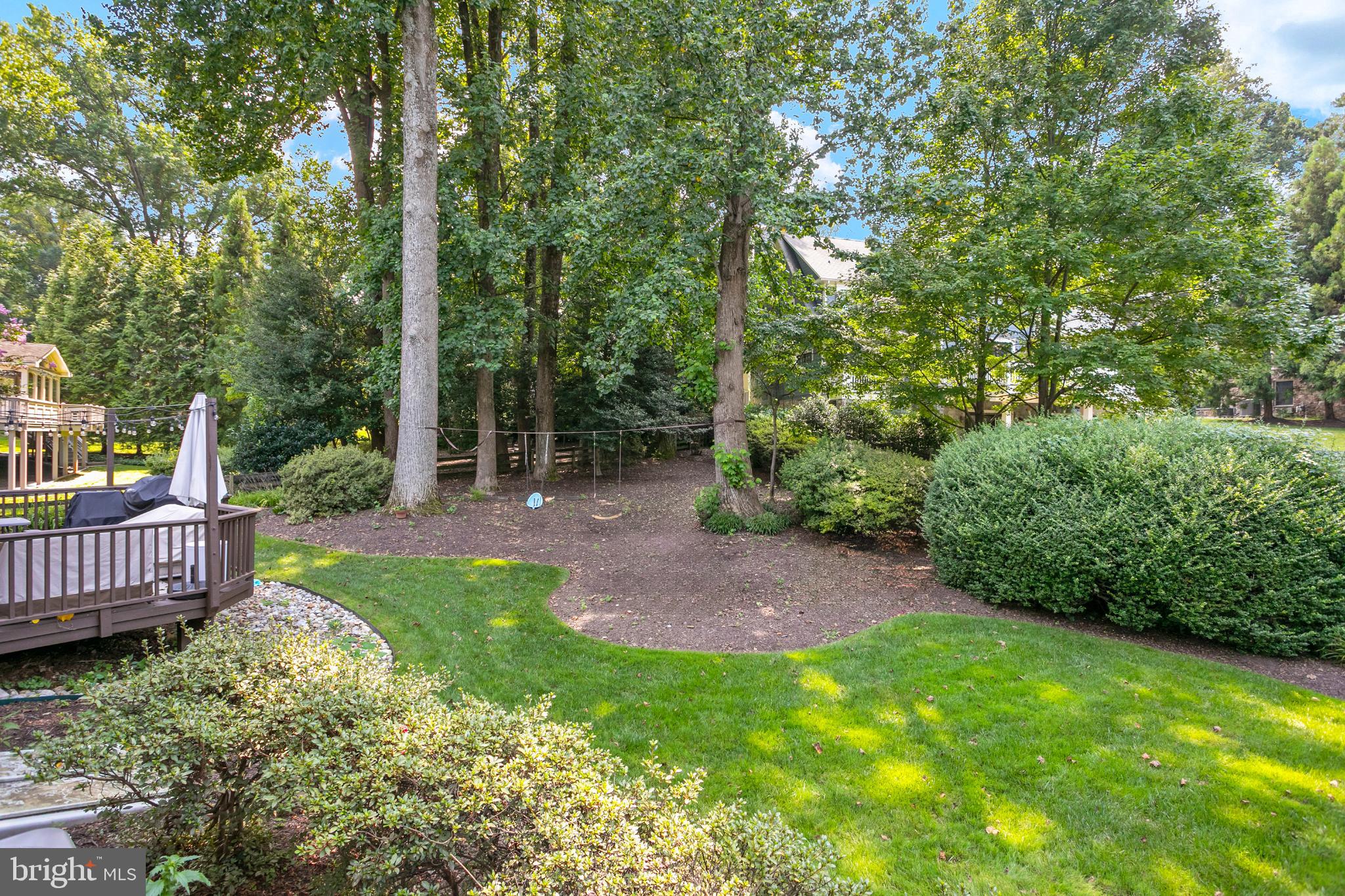 1212 Old Stable Road McLean, VA 22102 - Photo 29 of 33 a view of a yard with large trees and wooden fence