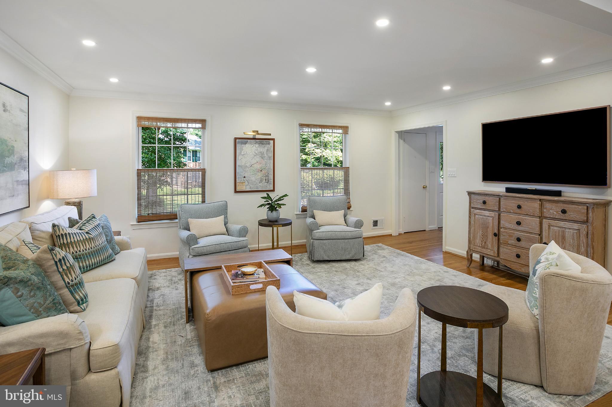 1212 Old Stable Road McLean, VA 22102 - Photo 4 of 33 a living room with furniture and a flat screen tv