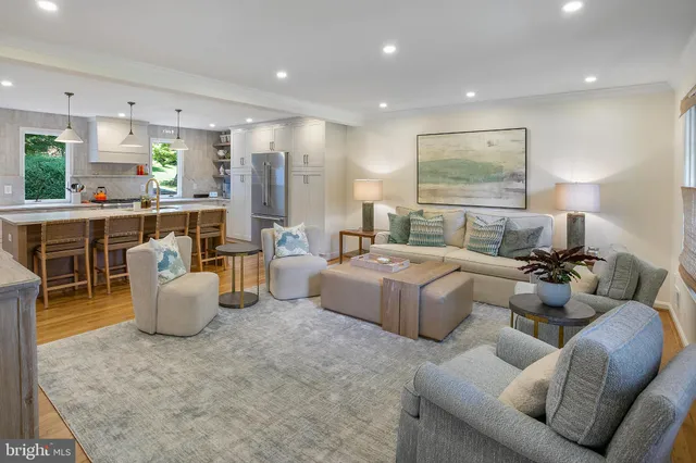 a living room with furniture and a table