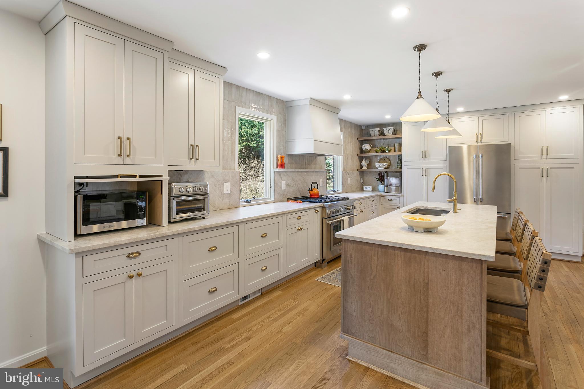 1212 Old Stable Road McLean, VA 22102 - Photo 8 of 33 a kitchen with sink cabinets and microwave
