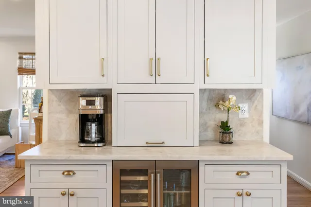 a kitchen with appliances cabinets and a counter top space