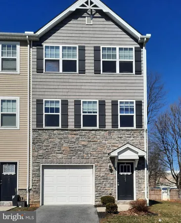 a front view of a house with a garage