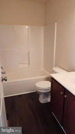 a bathroom with a toilet a sink and a bathtub