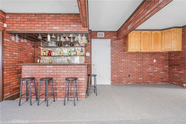 a kitchen with stainless steel appliances granite countertop a stove and a refrigerator