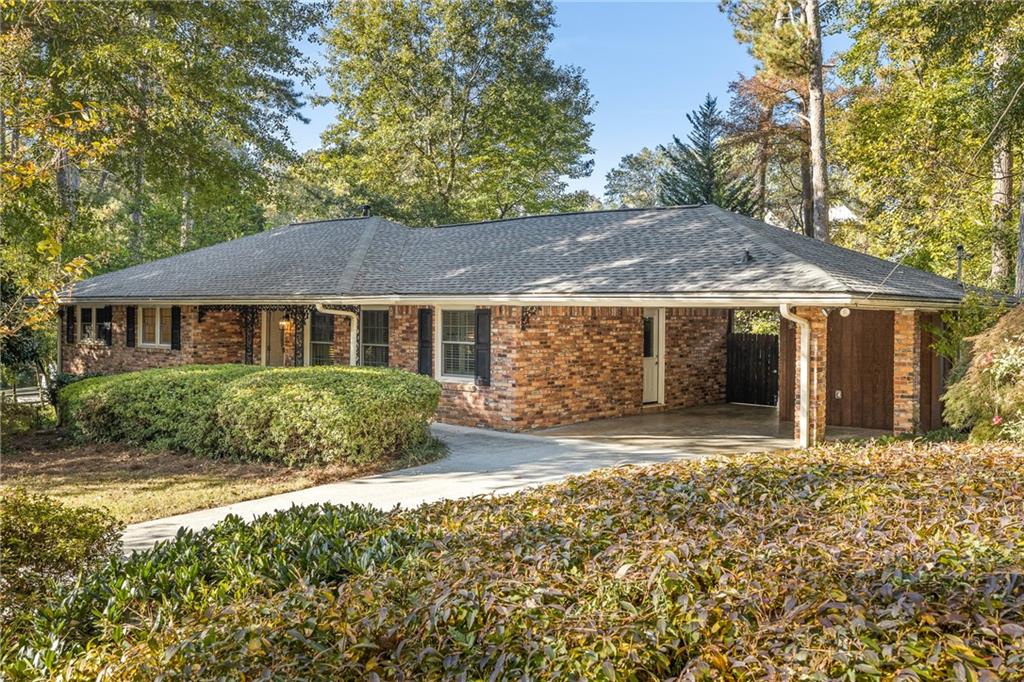 1470 Linkwood Lane Decatur, GA 30033 - Photo 1 of 1 a front view of a house with a garden and yard
