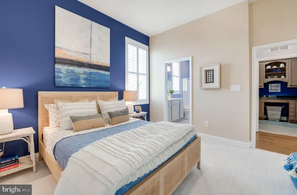 a bedroom with a bed and a book shelf