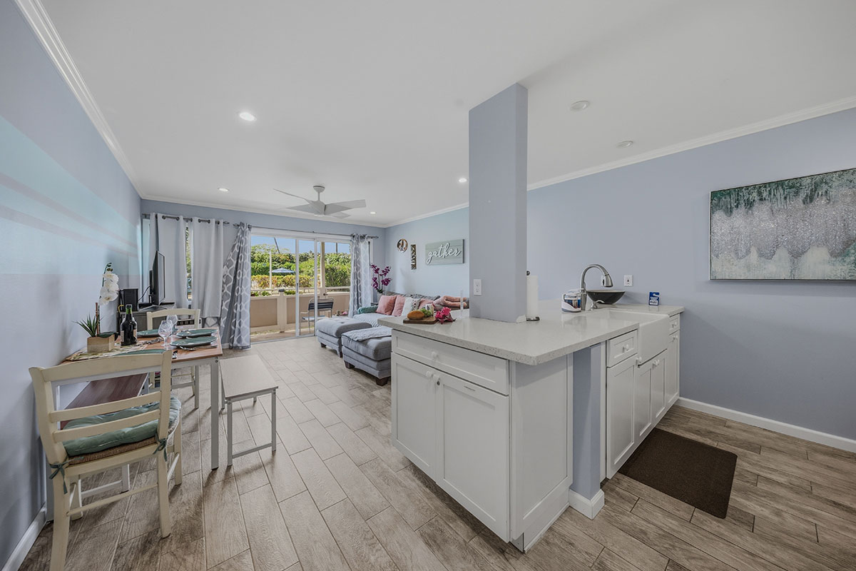 a kitchen with sink stove and cabinets