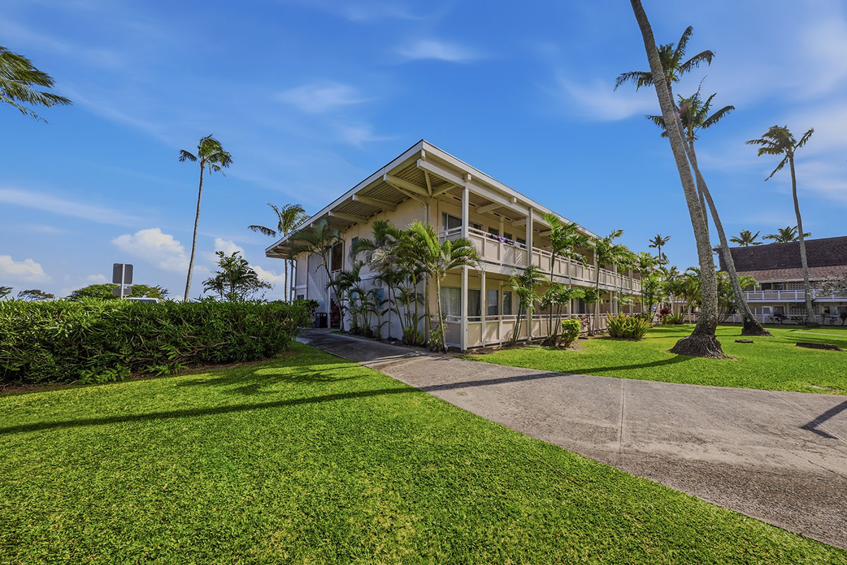 525 Aleka Loop, Unit J2 Kapaa, HI 96746 - Photo 25 of 30 a view of a house with a yard and potted plants