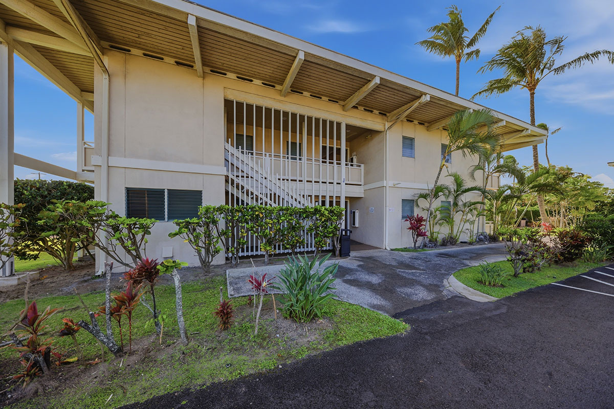 525 Aleka Loop, Unit J2 Kapaa, HI 96746 - Photo 26 of 30 a backyard of a house with a garden and plants