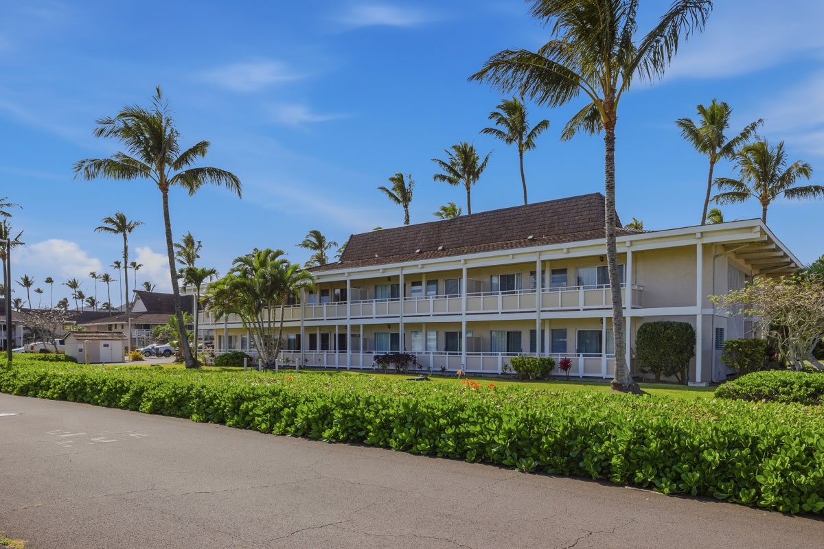 525 Aleka Loop, Unit J2 Kapaa, HI 96746 - Photo 28 of 30 a view of a house with a yard and potted plants