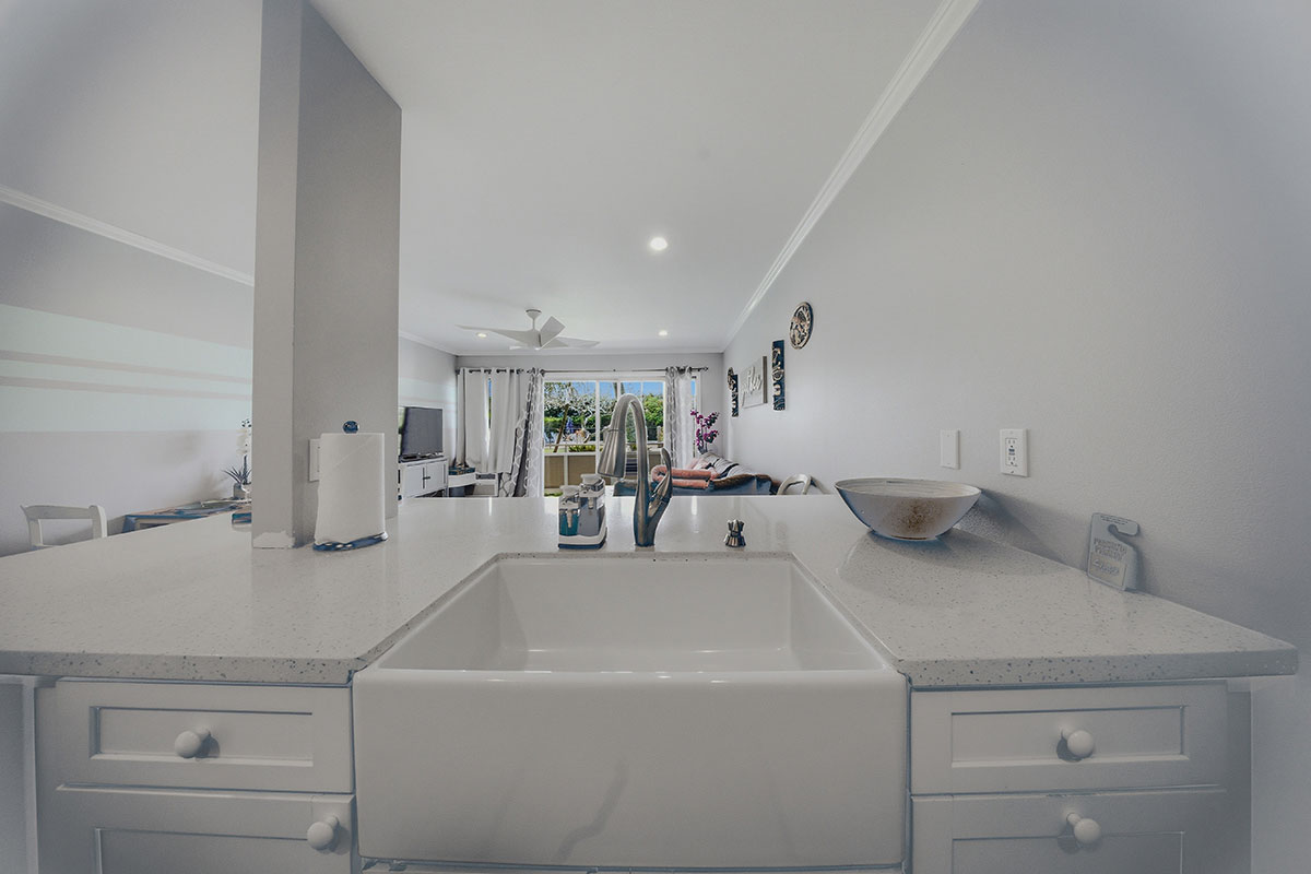 525 Aleka Loop, Unit J2 Kapaa, HI 96746 - Photo 4 of 30 a en suite bathroom with a sink and mirror