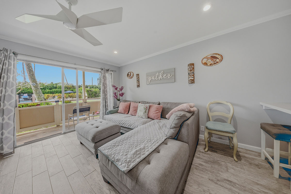 525 Aleka Loop, Unit J2 Kapaa, HI 96746 - Photo 9 of 30 a living room with furniture and a floor to ceiling window
