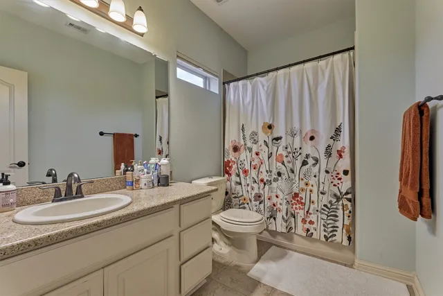 a view of a swimming pool with an outdoor seating