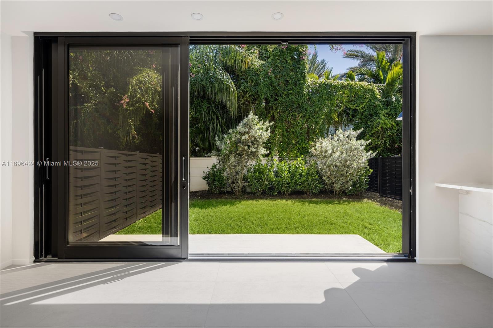 7498 Southwest 100th Street, Unit 8 Pinecrest, FL 33156 - Photo 13 of 61 a view of a car park from a window
