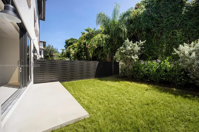 a view of backyard with green space