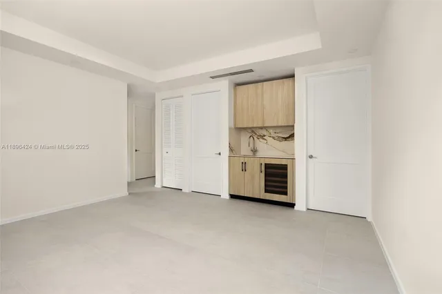 a view of empty room with a fireplace