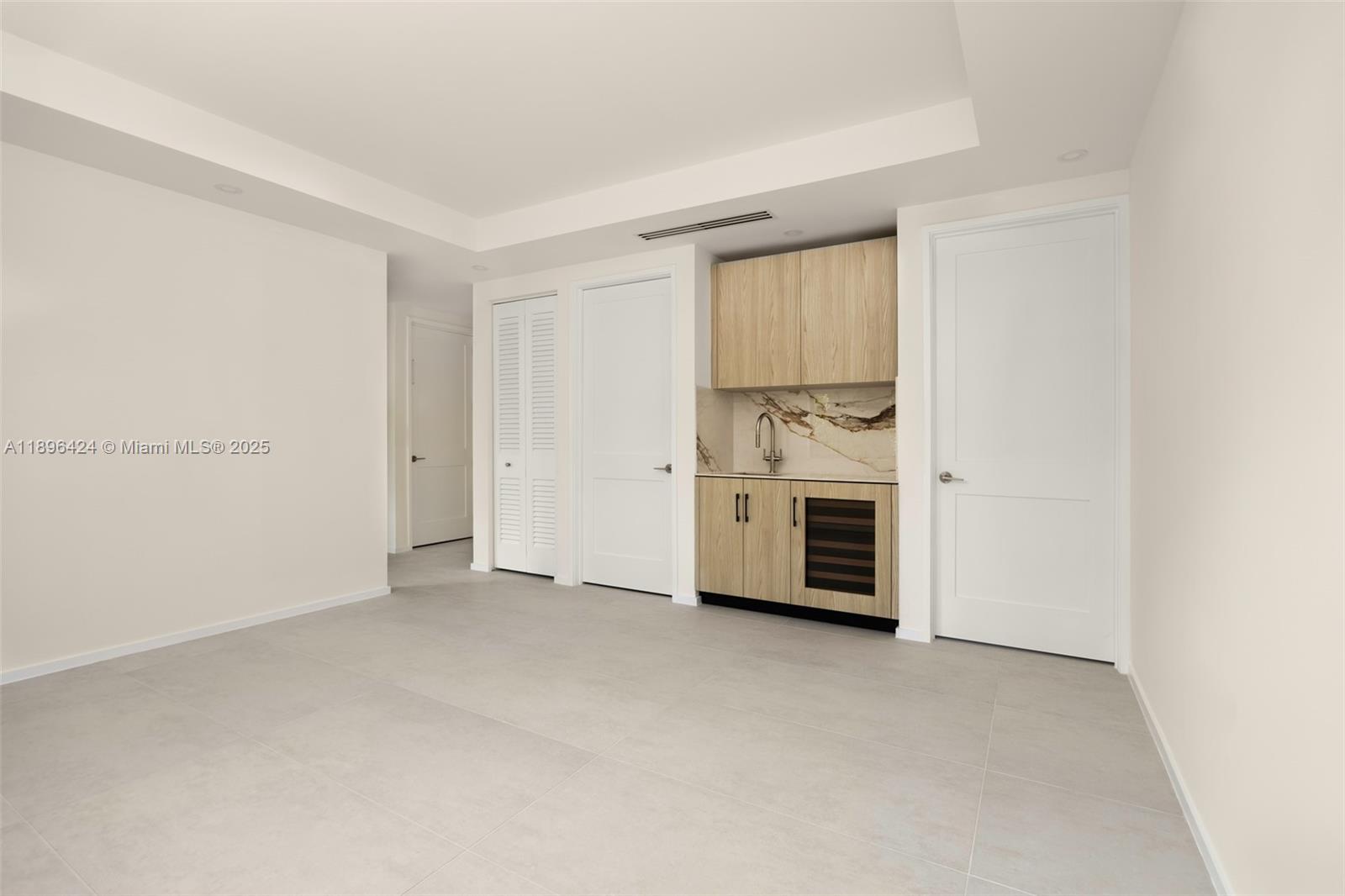 7498 Southwest 100th Street, Unit 8 Pinecrest, FL 33156 - Photo 16 of 61 a view of empty room with a fireplace