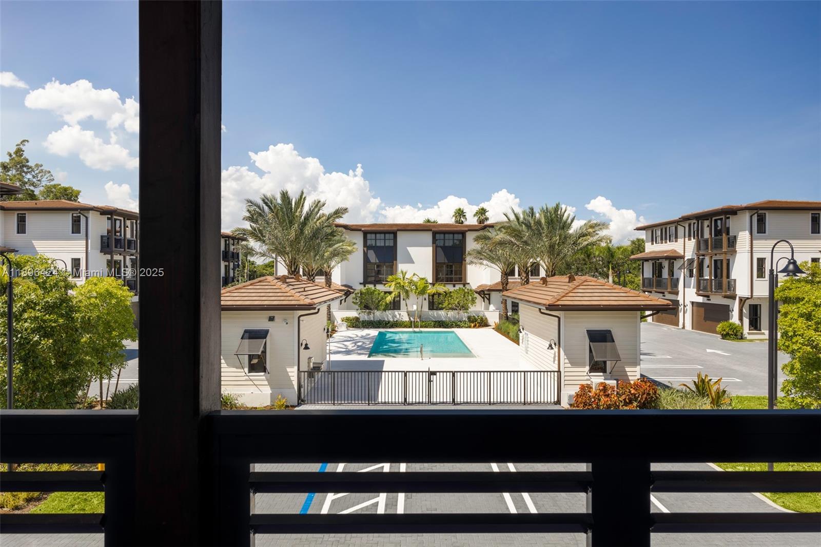7498 Southwest 100th Street, Unit 8 Pinecrest, FL 33156 - Photo 18 of 61 a view of a chairs and table in a balcony