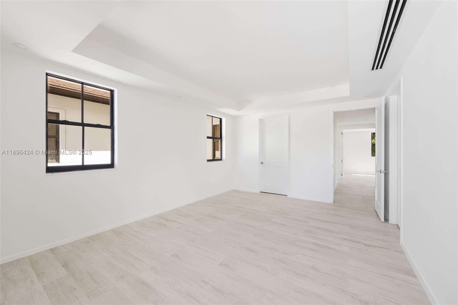 7498 Southwest 100th Street, Unit 8 Pinecrest, FL 33156 - Photo 19 of 61 an empty room with windows and closet