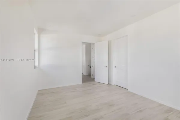 a view of an empty room with a window