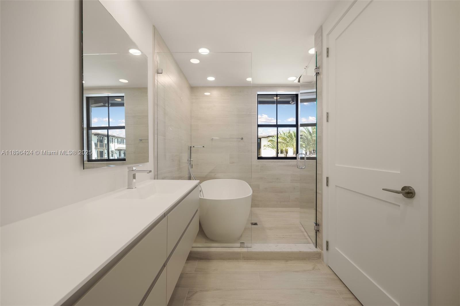 7498 Southwest 100th Street, Unit 8 Pinecrest, FL 33156 - Photo 30 of 61 a bathroom with a sink a toilet and shower
