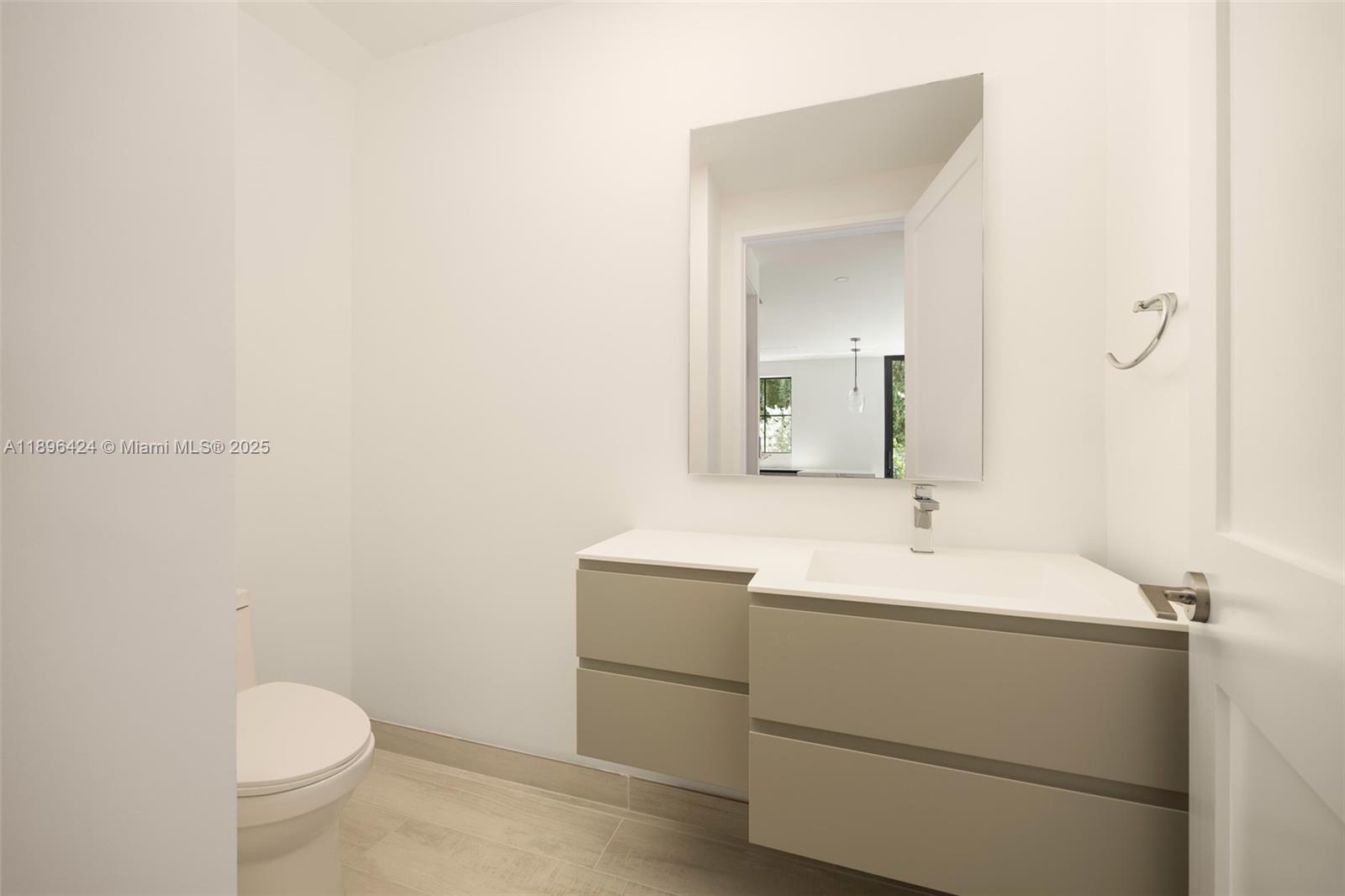 7498 Southwest 100th Street, Unit 8 Pinecrest, FL 33156 - Photo 33 of 61 a bathroom with a sink and a mirror