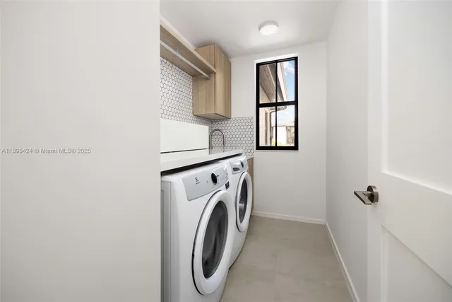 a front view of multi story residential apartment building with yard and sign board