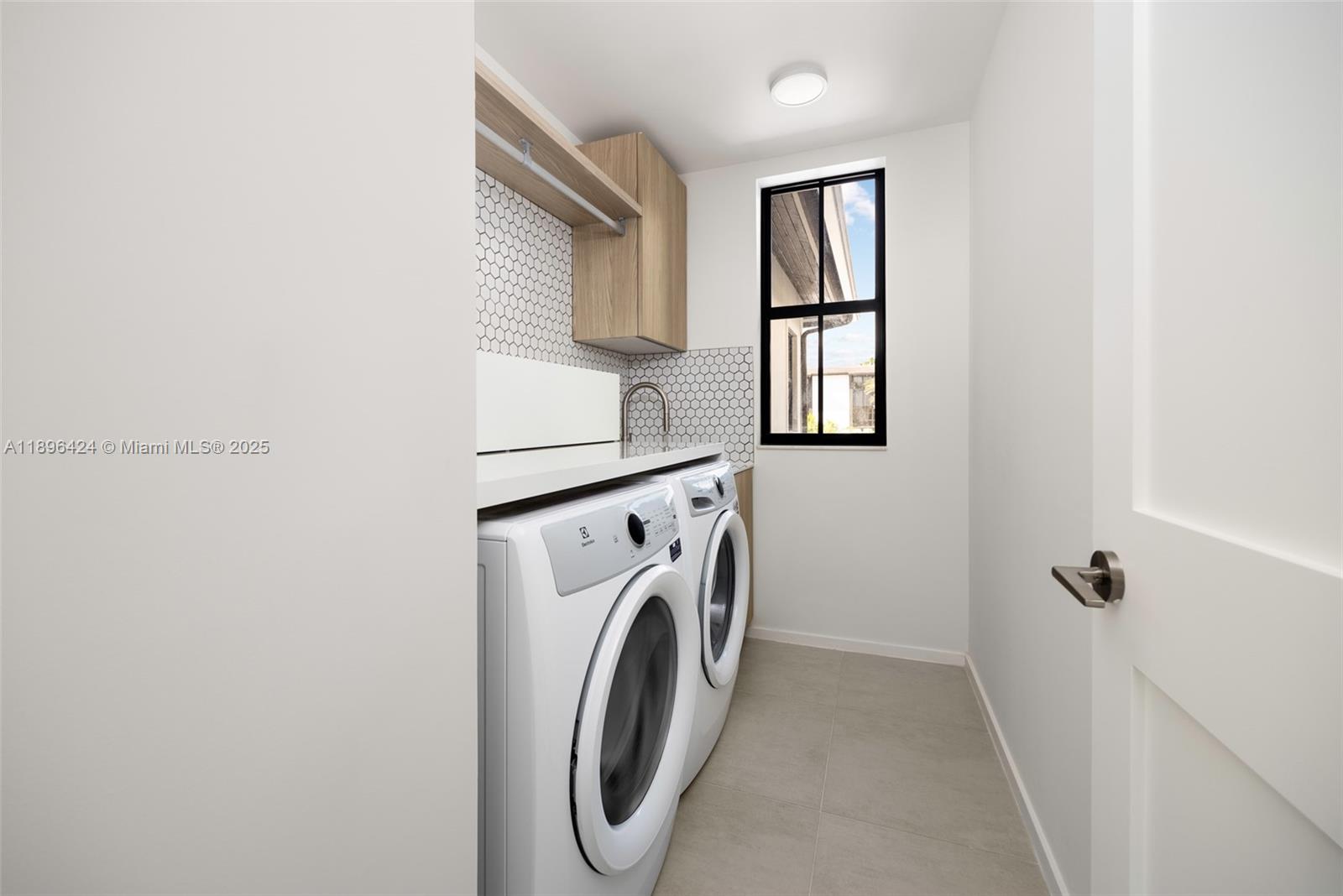 7498 Southwest 100th Street, Unit 8 Pinecrest, FL 33156 - Photo 38 of 61 a utility room with dryer and washer