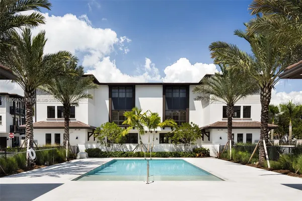 a front view of a building with outdoor seating