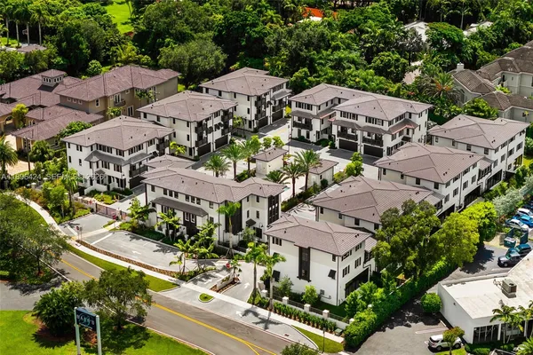 an aerial view of houses with outdoor space